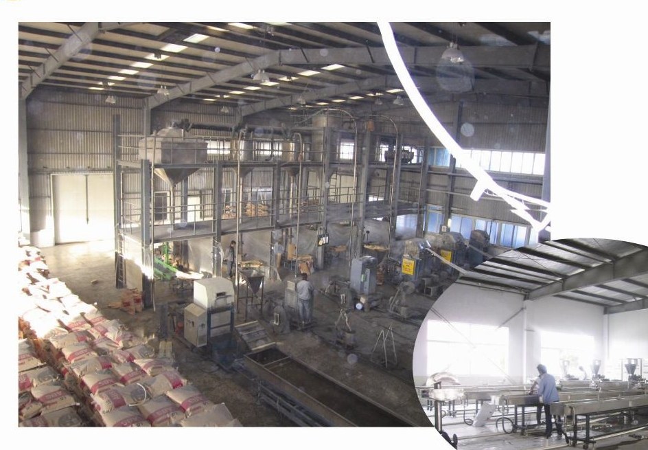 Production workshop with twin-screw compounding lines and bagged finished compound